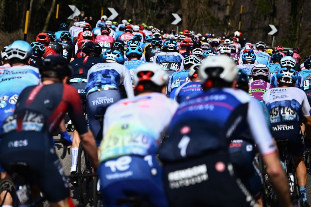 The pack rides during the 113th MilanSan Remo oneday classic cycling race on March 19 2022 between Milan and San Remo northern Italy Photo by Marco BERTORELLO AFP Photo by MARCO BERTORELLOAFP via Getty Images