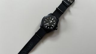 The Certina DS Action 43mm in Black, on a grey background