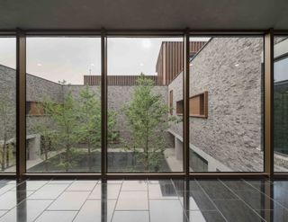 Junshan Cultural Center looking out on to a courtyard with trees