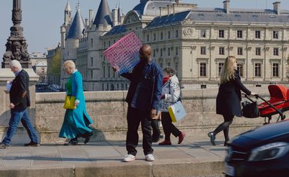 Virgil Abloh obituary portrait, shows Abloh on Pont Neuf in Paris, photographed for Wallpaper* by Marvin Leuvrey