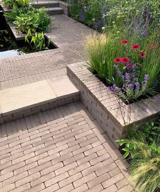 paved pathway and raised beds