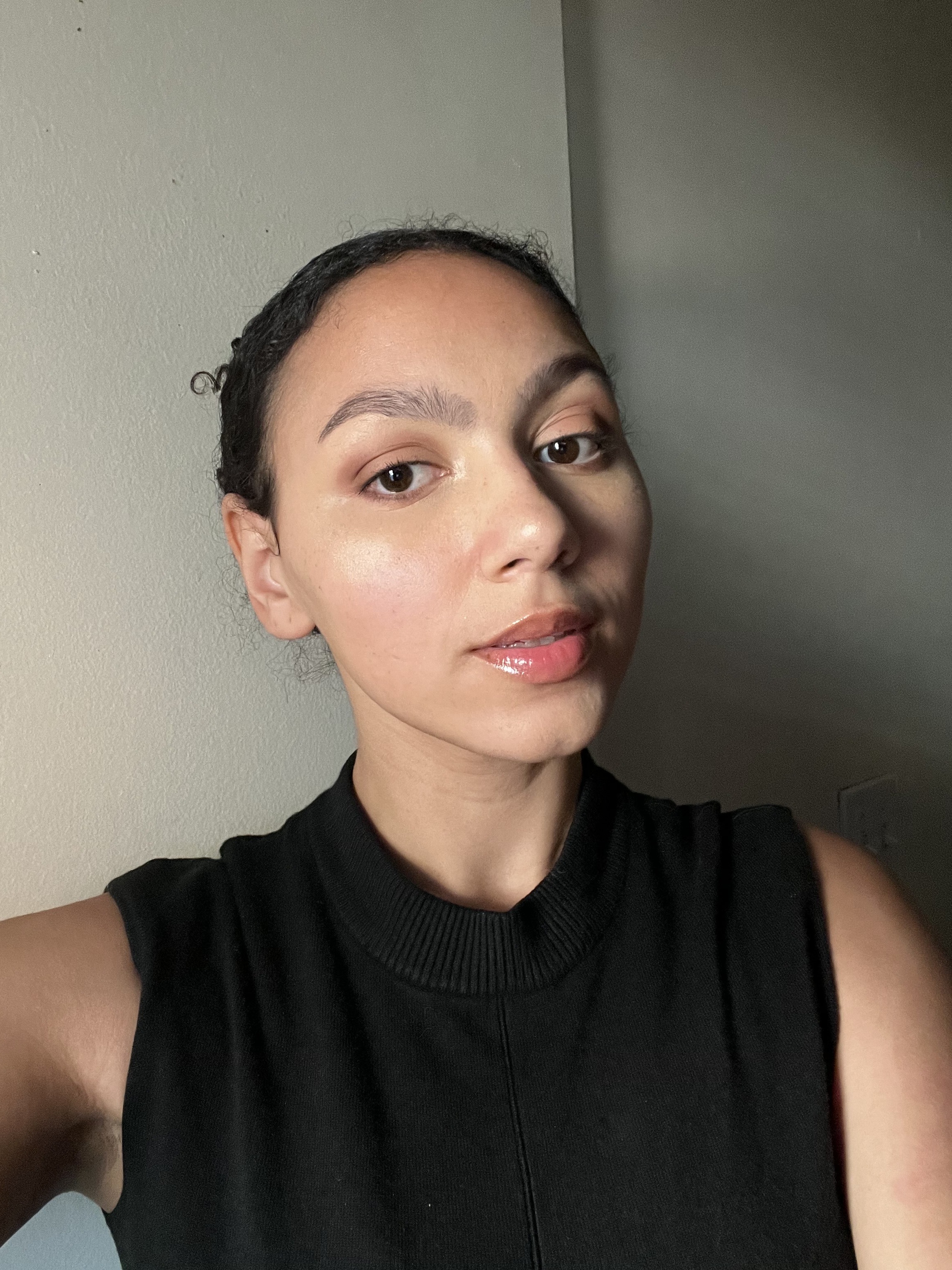 Who What Wear assistant beauty editor Sabrina Talbert wearing the SHEGLAM Skin Magnet High Coverage Foundation Stick