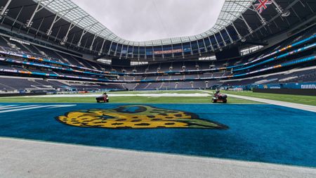 Wide view across the Jacksonville Jaguars end zone and empty stands inside Tottenham Hotspur Stadium ahead of an NFL London game.