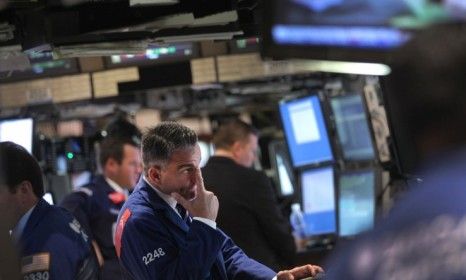 Traders on the New York Stock Exchange: Things aren&amp;#039;t looking good for Wall Street, which may see 10,000 jobs cut in the securities industry by 2012.