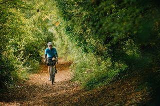 Image shows rider out in the countryside on a gravel ride.