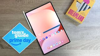Samsung Galaxy Tab S10 Ultra on table with S Pen and Book beside it with Tom's Guide Prime Day badge