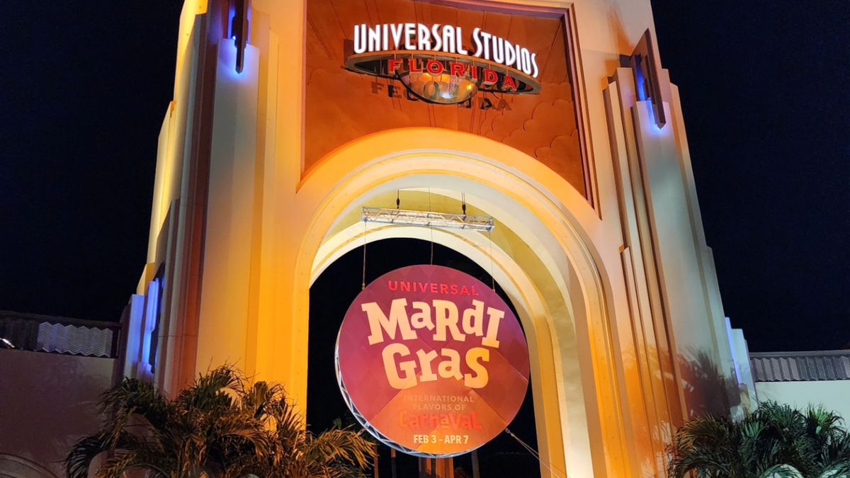 Universal Studios Florida&#039;s front gate pictured at night for Universal Mardi Gras 2024.