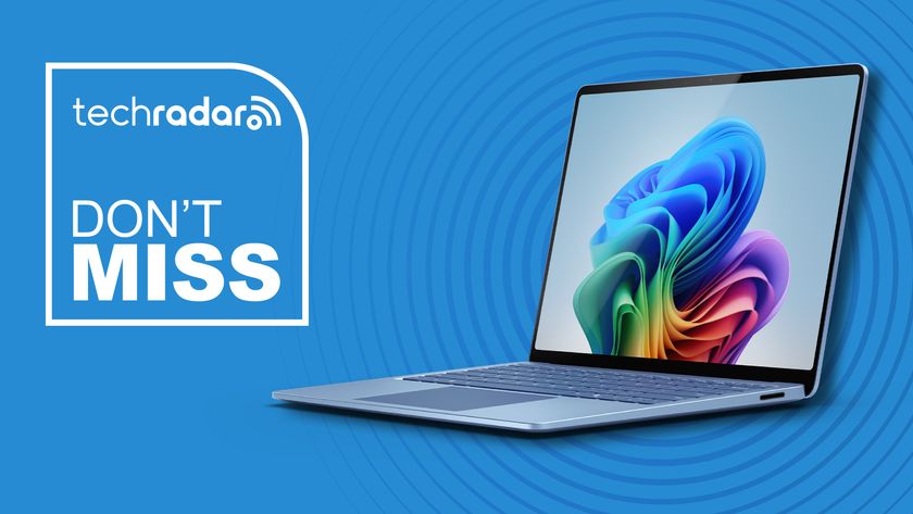 Microsoft Surface 7 laptop against a blue TechRadar deals background