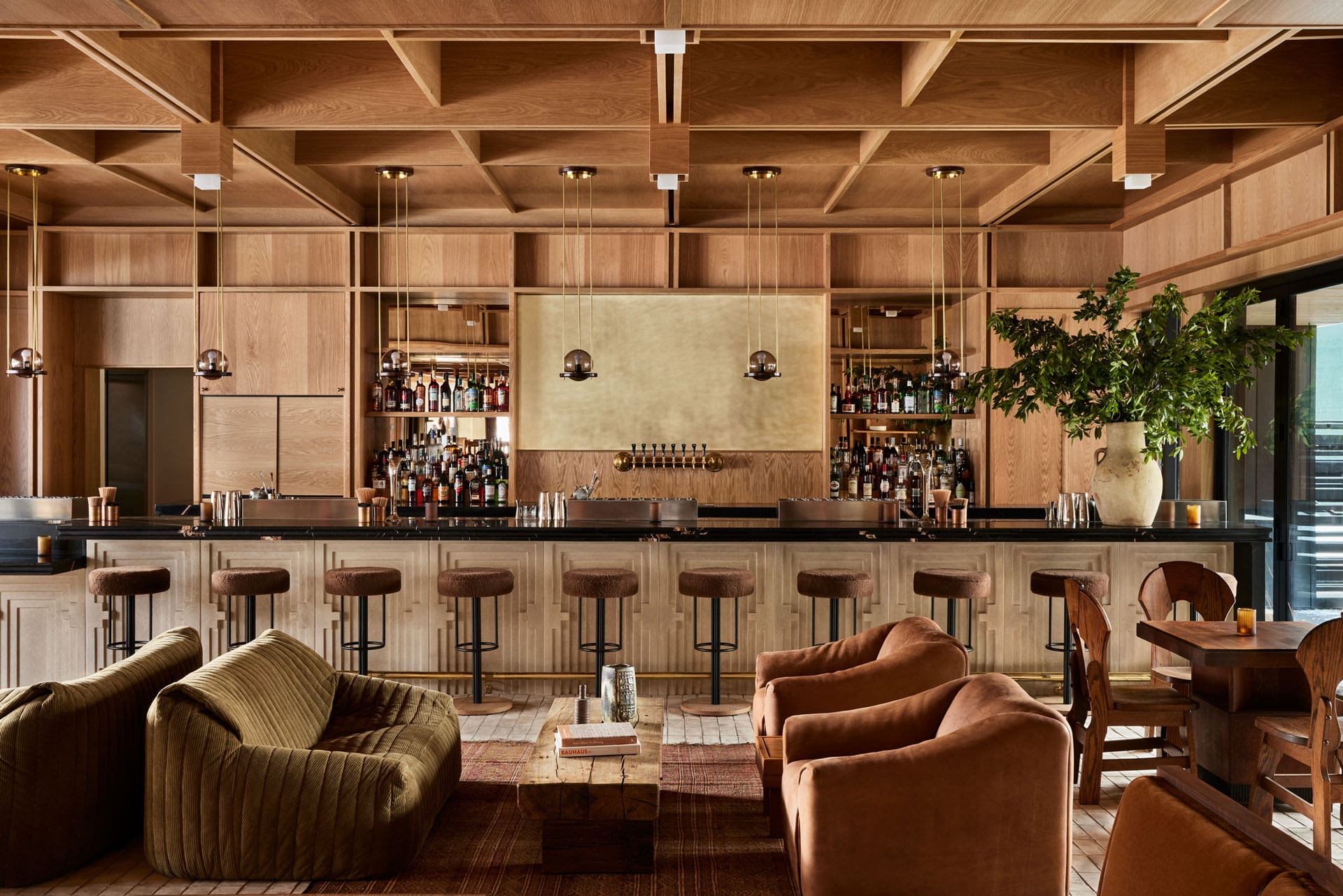 An earthy, sophisticated, and hip Colorado hotel boasts 1970s-inspired interiors with sculptural furnishings in organic tones.