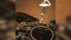 This photo is the first color view of Mars from China's Zhurong rover, looking toward its rear, from its landing spot on a plain in Utopia Planitia following a May 14, 2021 landing. This image was released May 19, 2021.