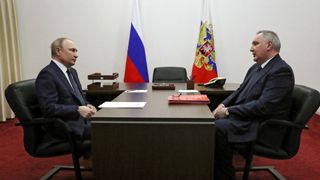 Russian President Vladimir Putin speaks with Roscosmos Director Dmitry Rogozin on April 12, 2022.