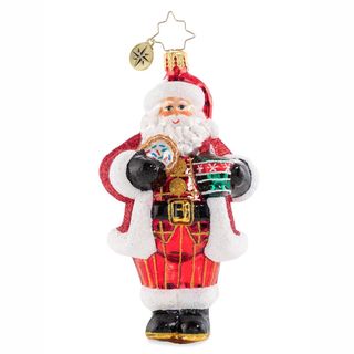 A santa ornament holding a doughnut and coffee