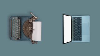 Laptop and a typewriter sitting on a blue table