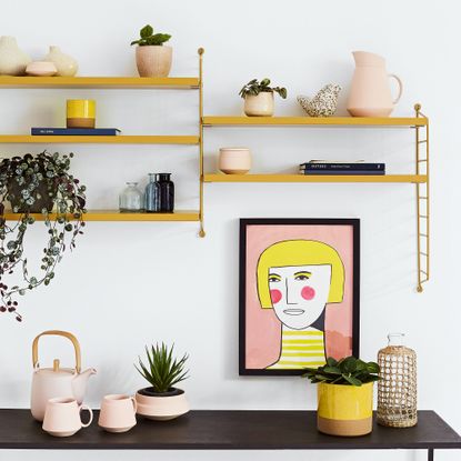 Sideboard with yellow shelving above