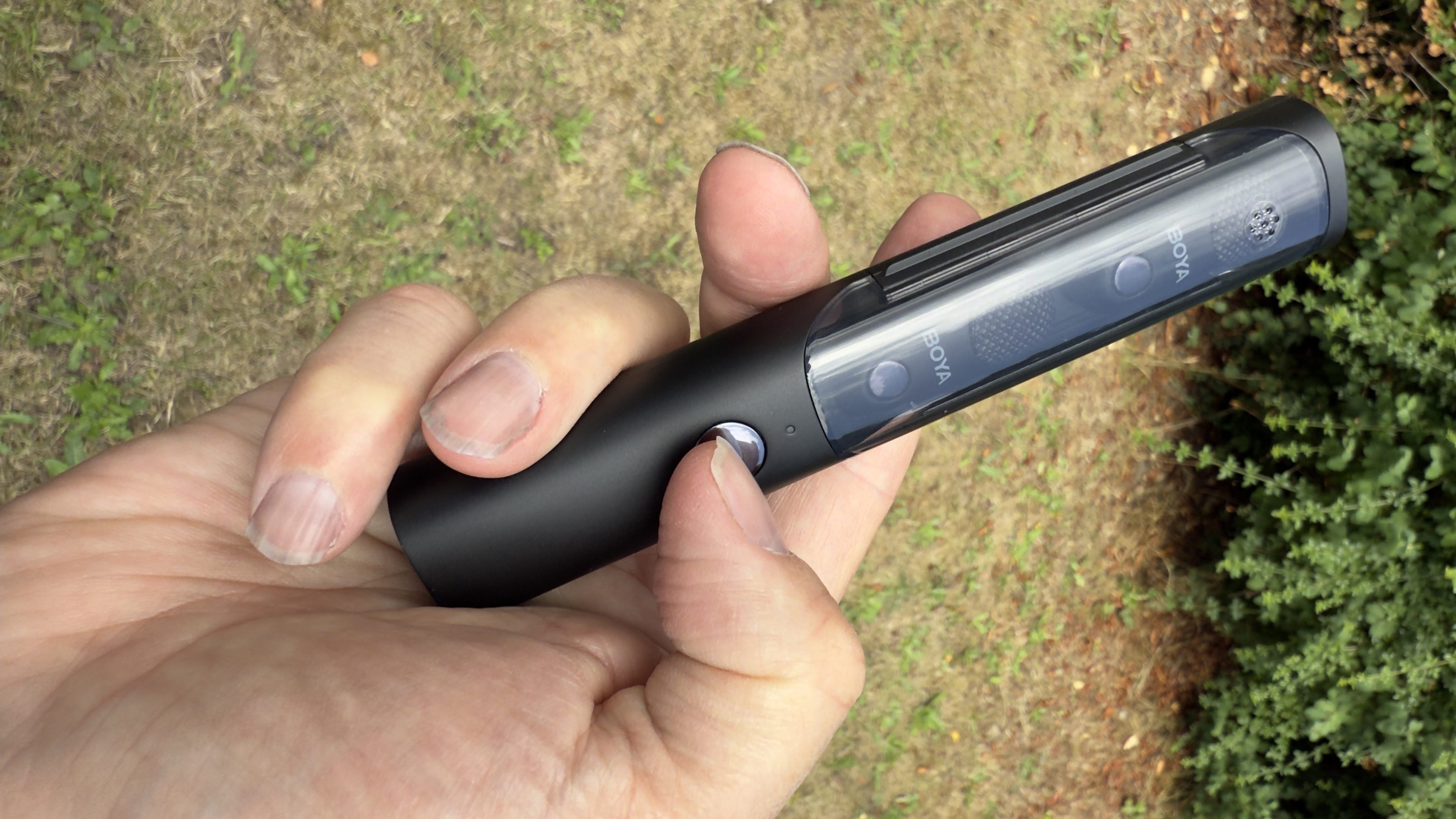 Shot of the plastic carry case with the two lavalier mics visible through its transparent lid