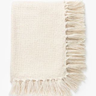 A white tufted throw pillow from McGee & Co.