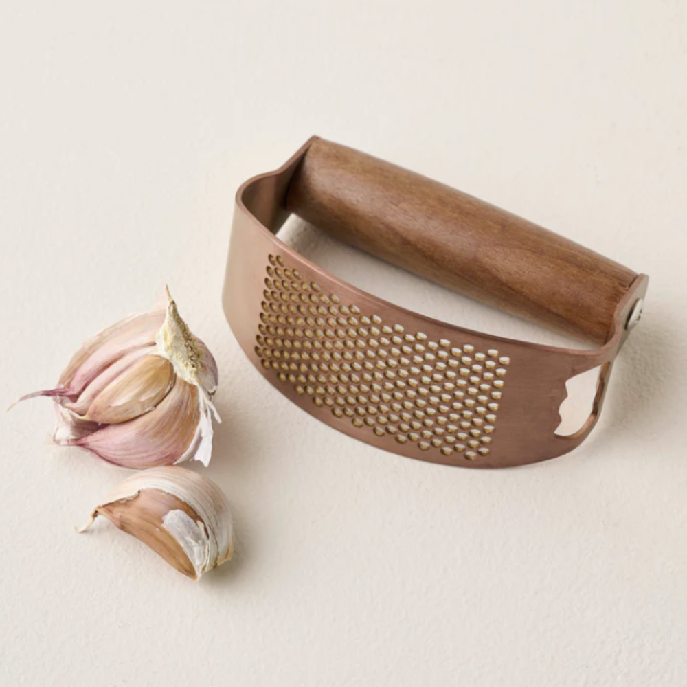 Copper garlic rocker with open bulb of garlic