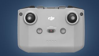 The DJi Mini 2 SE's controller on a blue background