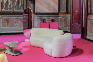 Pink room with white sofa