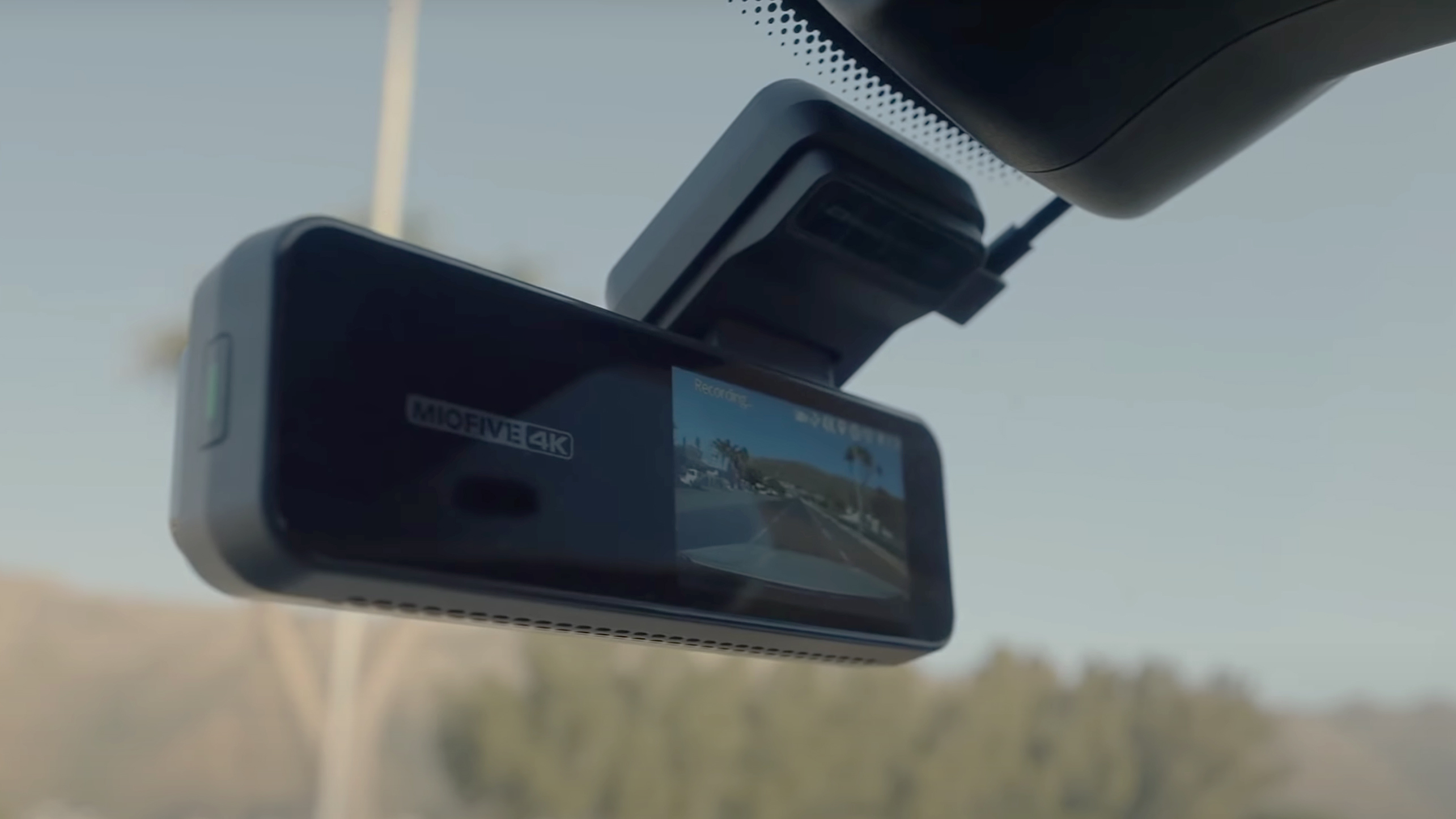 The Miofive 4K dash cam mounted on a car windhshield