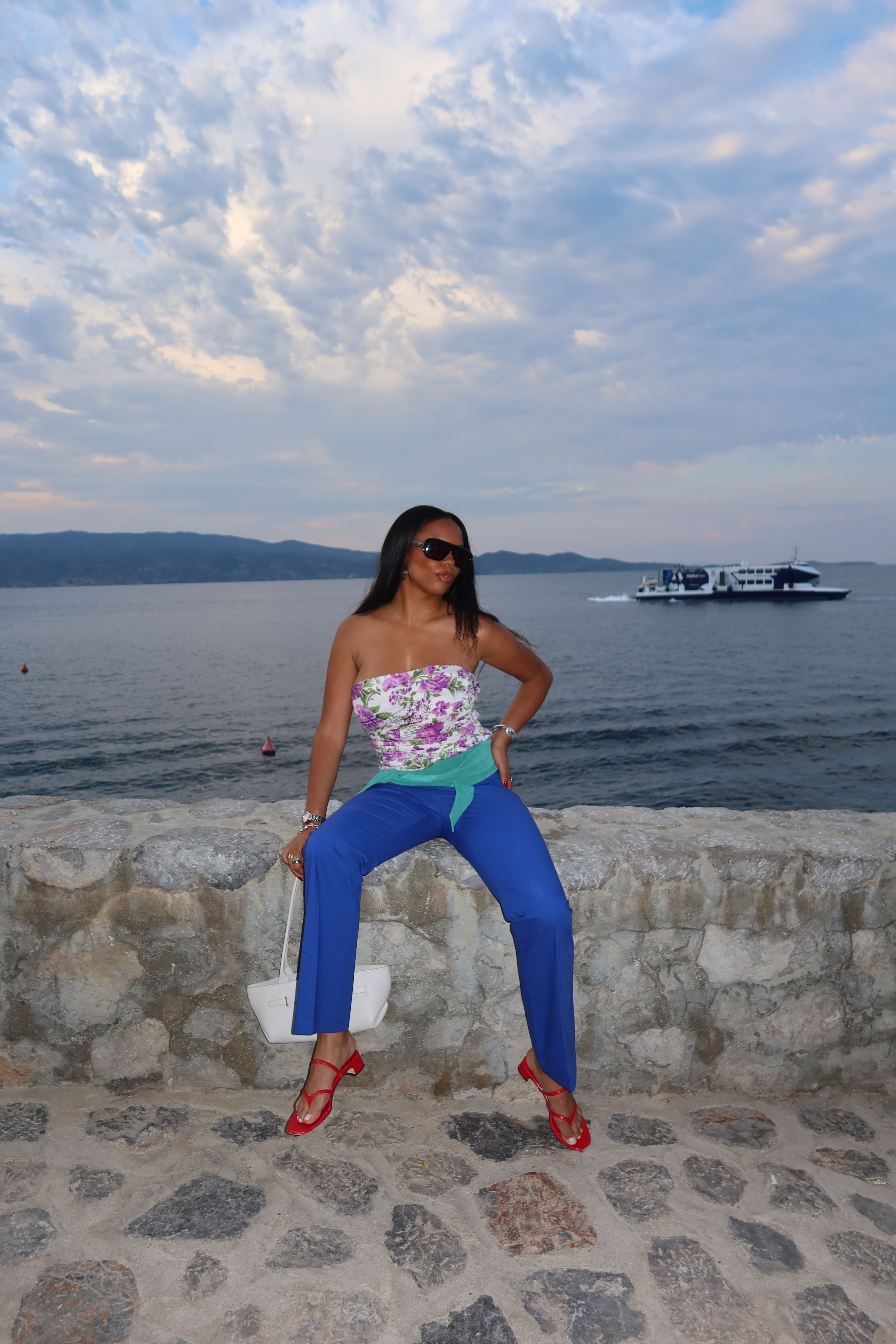 Sierra Mayhew wearing a stylish outfit in Greece.