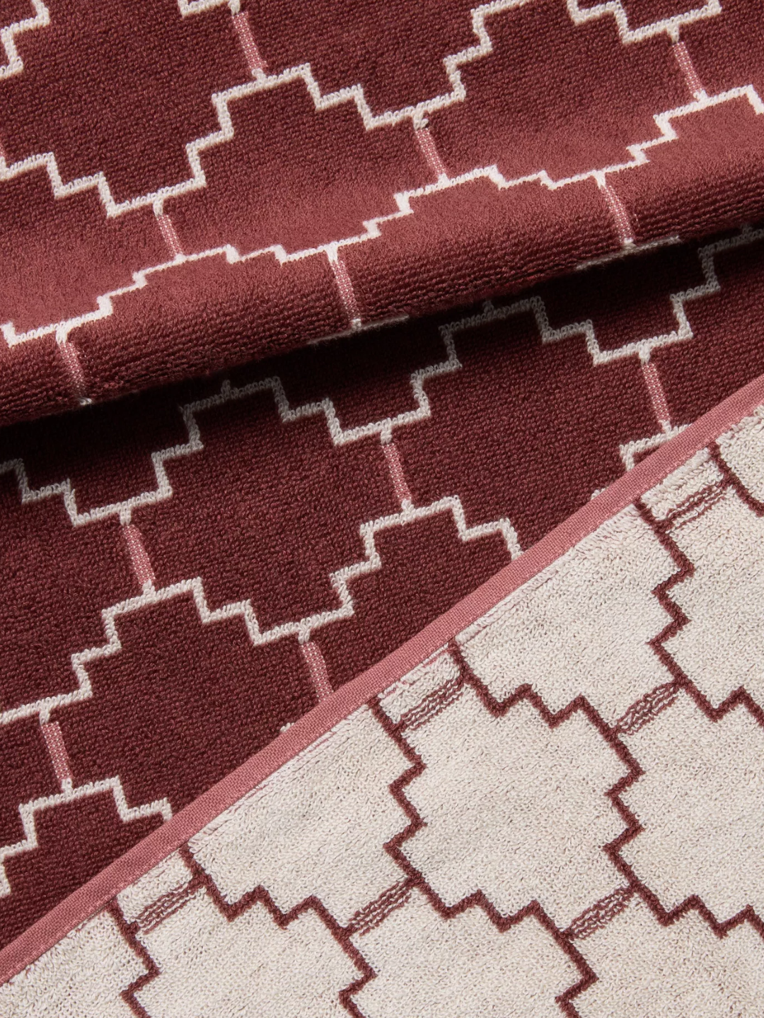A geometric burgundy bath towel from John Lewis
