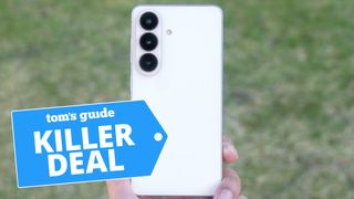 Galaxy S26 held in hand in front of grass