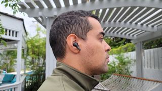 OnePlus Buds Pro in a man's ear