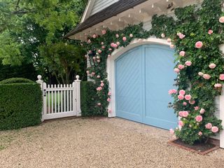 front of house with pink climbing roses
