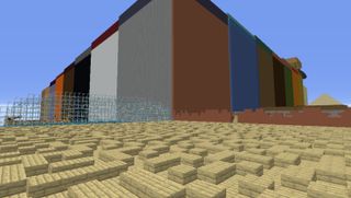 A huge square builing overlooking a wooden maze in Minecraft