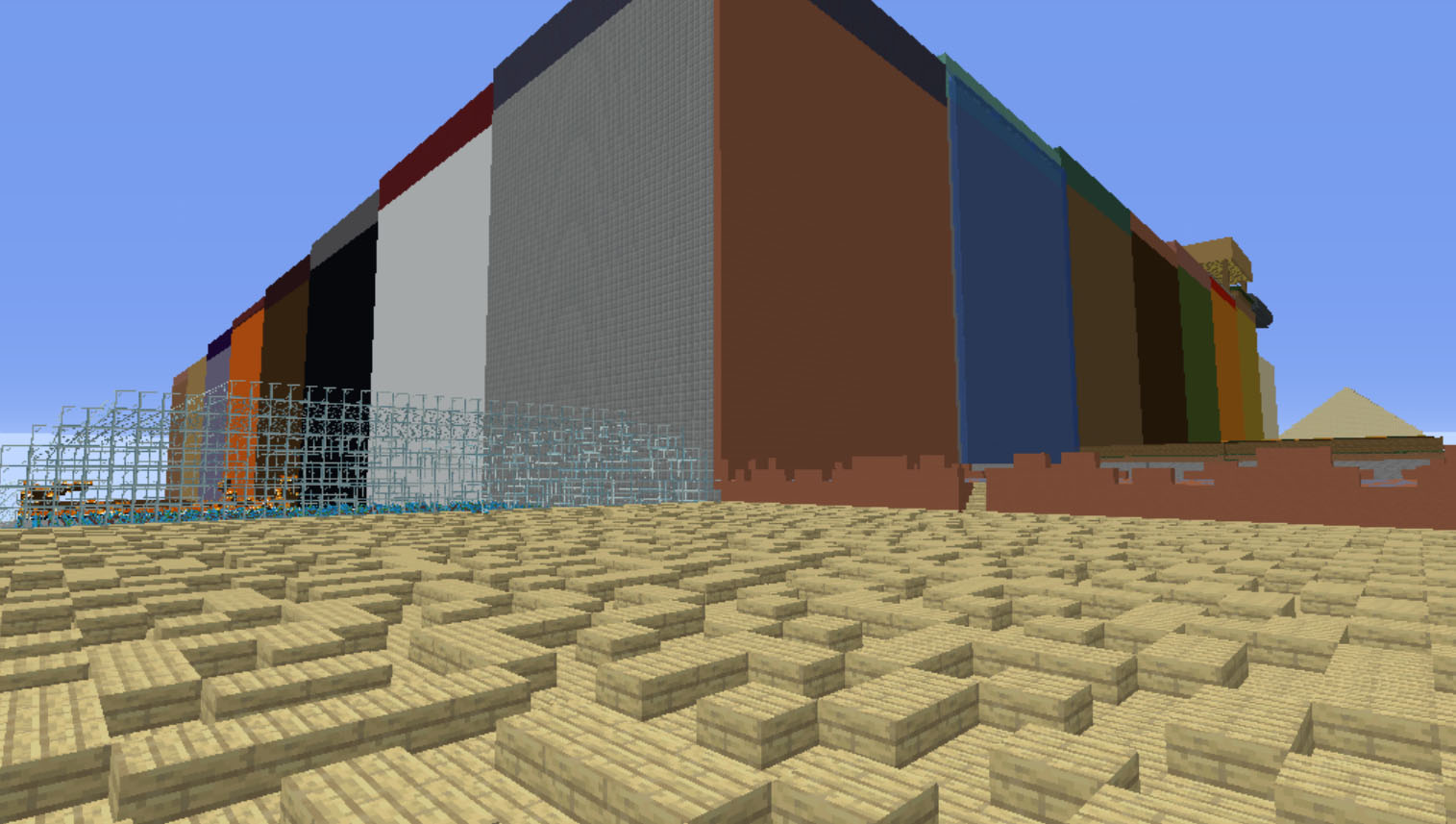 A huge square builing overlooking a wooden maze in Minecraft