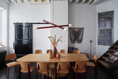 A living room with wooden dining table