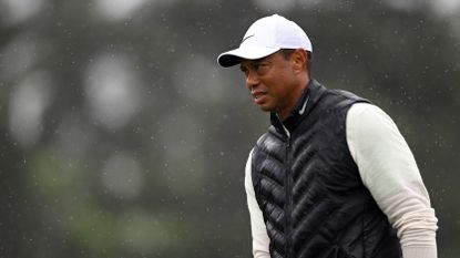 Tiger Woods of the United States looks on from the 18th green during the continuation of the weather delayed second round of the 2023 Masters Tournament at Augusta National Golf Club