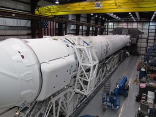 SpaceX's Falcon 9 rocket and Dragon spacecraft mated for launch.