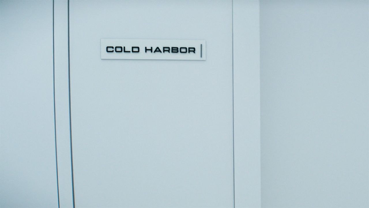 A white door with the sign Cold Harbor on it in Severance season 2