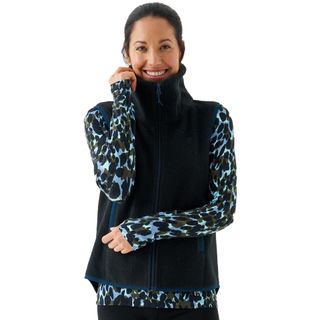 A woman wearing a BAM Bamboo Women’s 73 Zero Fleece Gilet