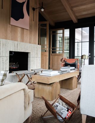 a black and wood sunroom designer with a mix of furniture