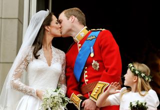 Kate Middleton and Prince William kiss on the Buckingham Palace balcony on their wedding day, April 29, 2011