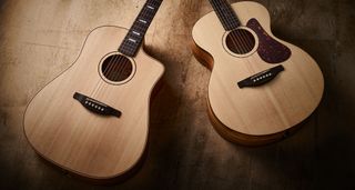 Fenech VT Camphor Laurel Auditorium and Fenech VT Professional Blackwood Dread D78: the two high-end natural finish acoustics are photographed against an earth toned background.