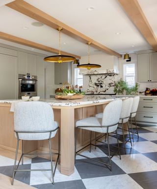 Luxurious kitchen island in modern space with checkerboard floor