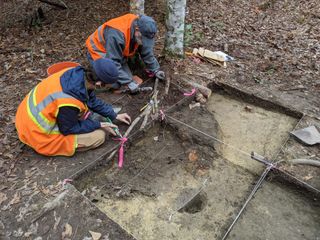 Archaeologists and volunteers uncover the newly-discovered still in Hell Hole Swamp