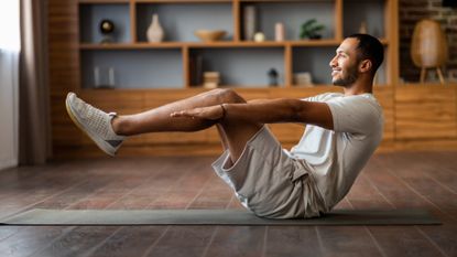 Indian Man Making Abdominal Exercises At Home Stock Photo, 53% OFF