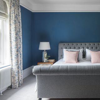 Blue bedroom with upholstered bed