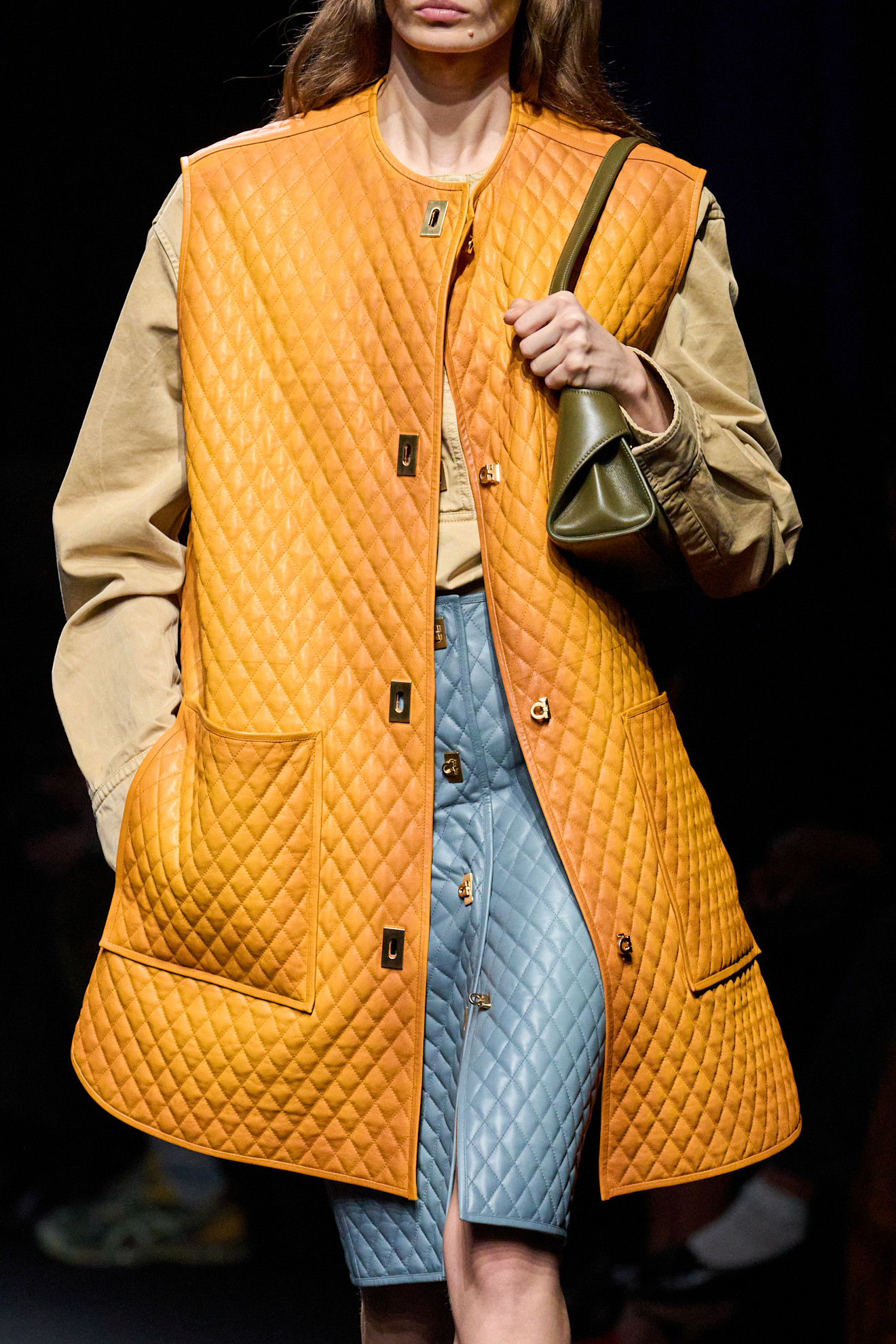 A model wore orange and camel on Ferragamo's Fall 2026 runway