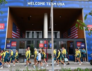 olympic athletes enter and exit the village