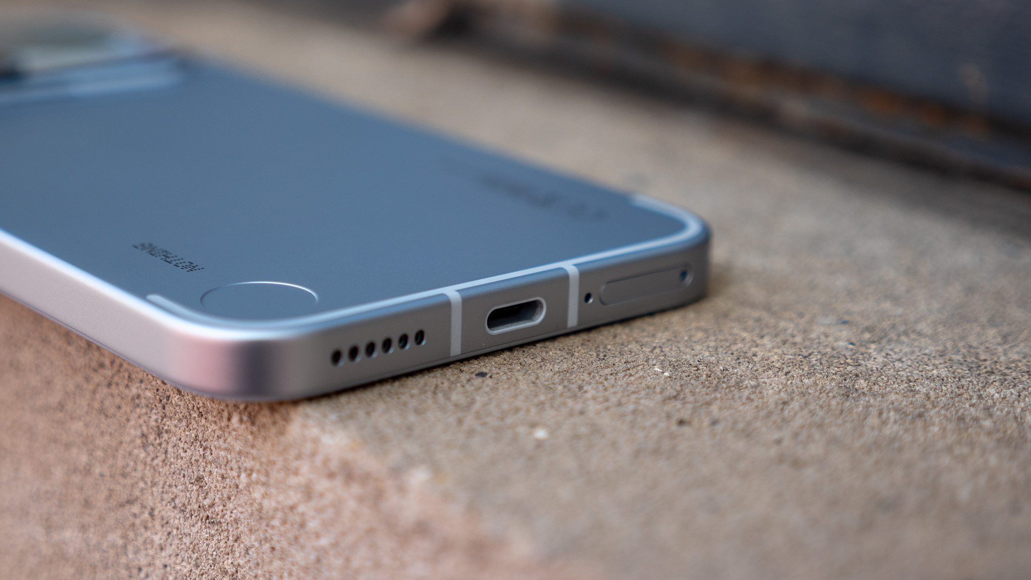 A close-up look at the buttons, ports, and camera lenses on the Nothing Phone 4a Pro