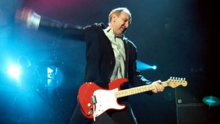 Pete Townshend performing live onstage, in 2009, playing Fender Stratocaster guitar, doing 'windmill' arm
