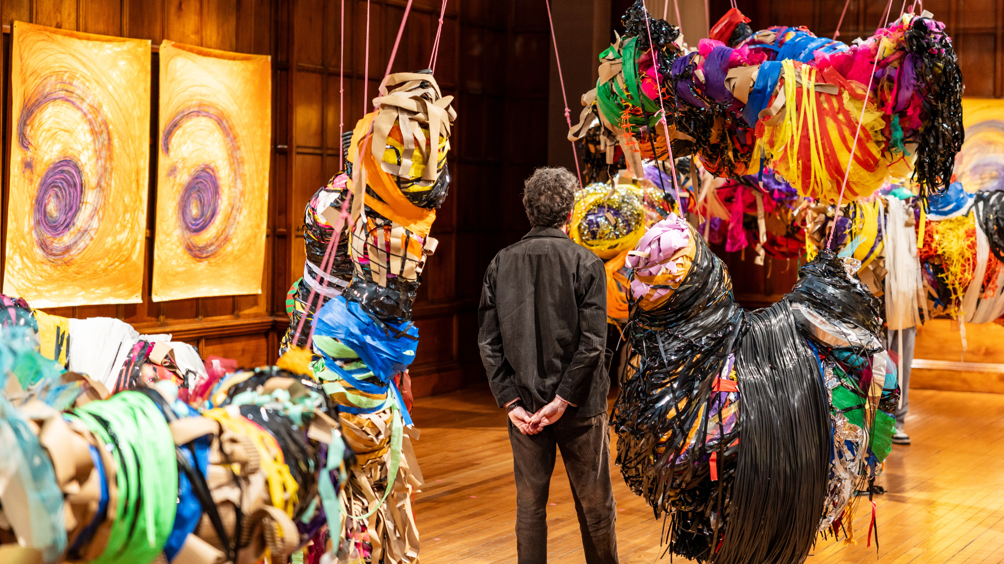 A man looking at Nnela Kalu's sculptural artwork at the Turner Prize exhibition