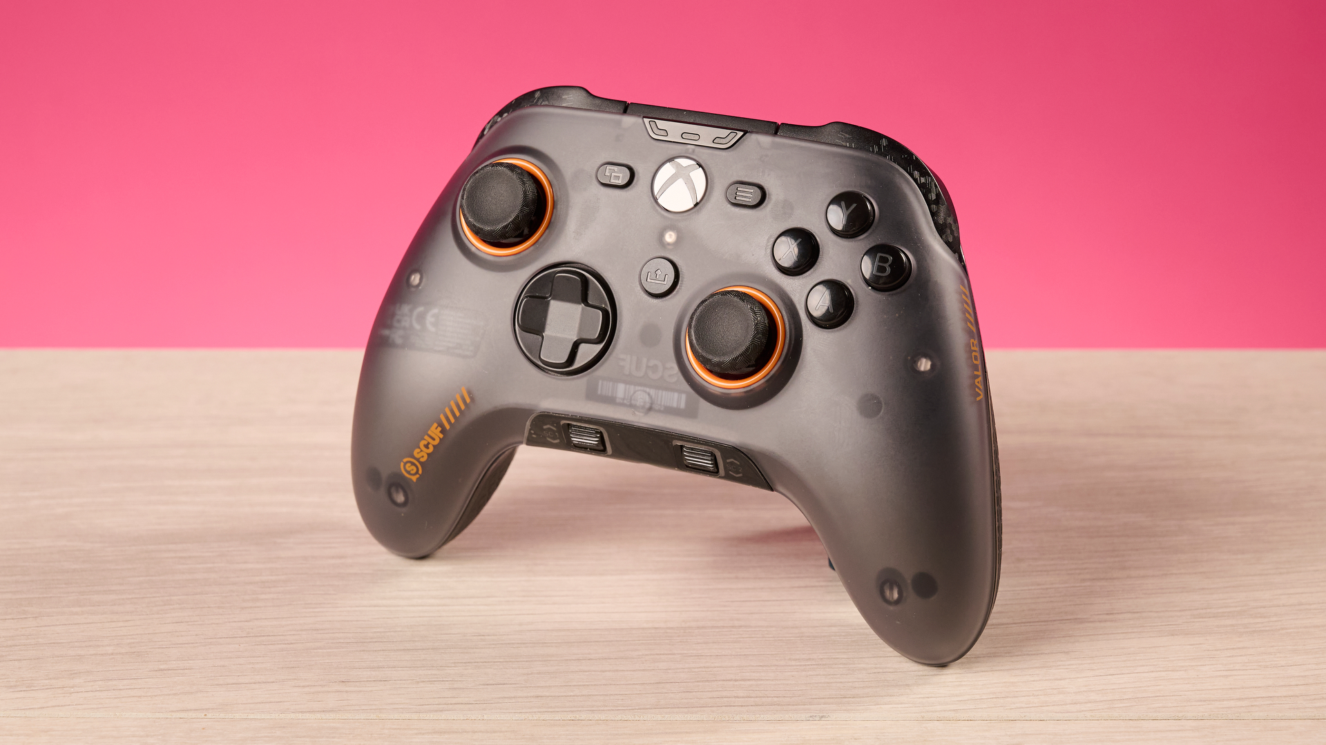 The Scuf Valor Wired with TMR in front of a pink background.