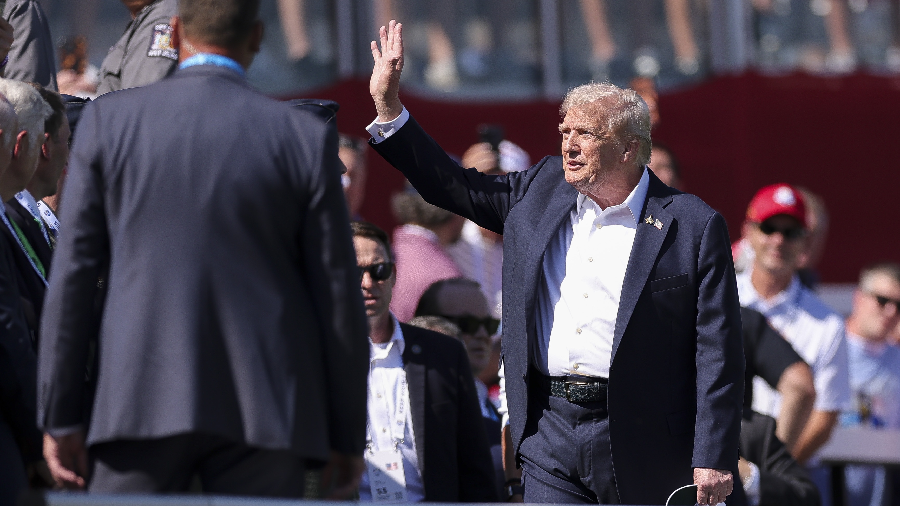 U.S. President Donald Trump acknowledges the crowd on the first tee during the Friday afternoon four-ball matches of the 2025 Ryder Cup at Black Course at Bethpage State Park Golf Course on September 26, 2025 in Farmingdale, New York. 